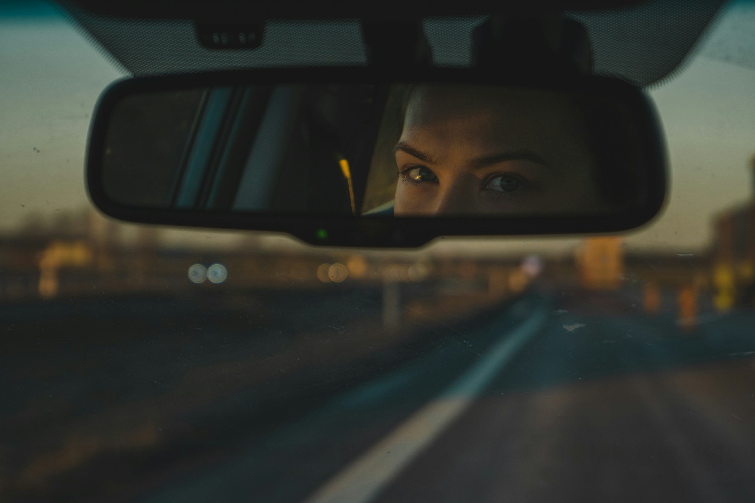 The Little Tab Under Your Rearview Mirror Most Drivers Never Use